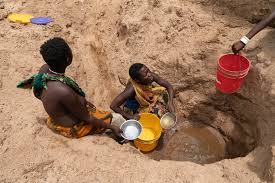 Hadzabe Tribe women gathering water near Lake Eyasi Tanzania
